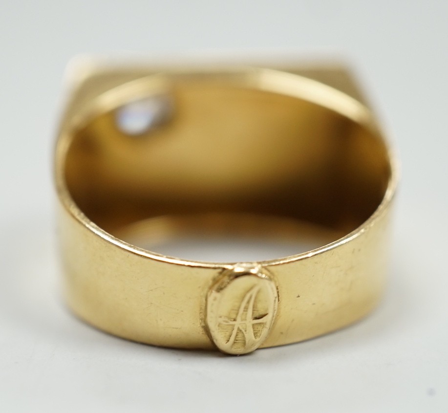 A 750 yellow metal and single stone diamond set signet ring, size Q/R, gross weight 10 grams.